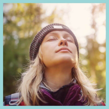 Woman inhaling a deep breath